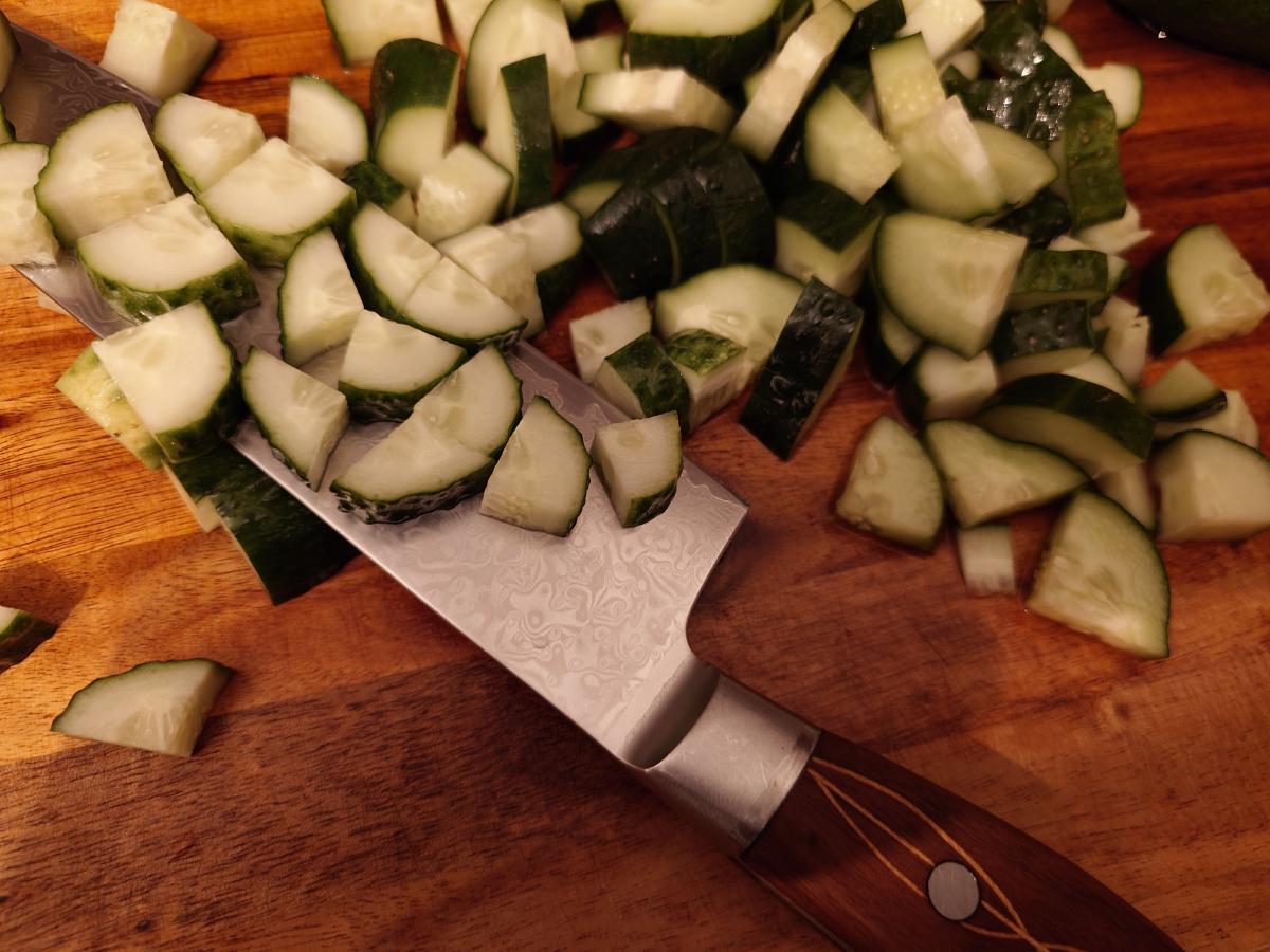 Cucumber cut into chunks on the board