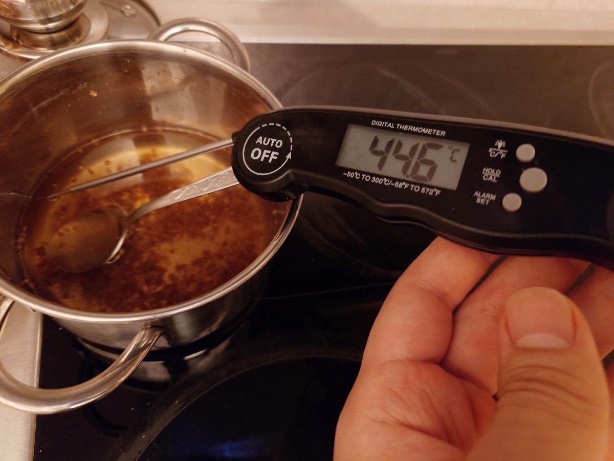 Checking the brine temperature before pouring