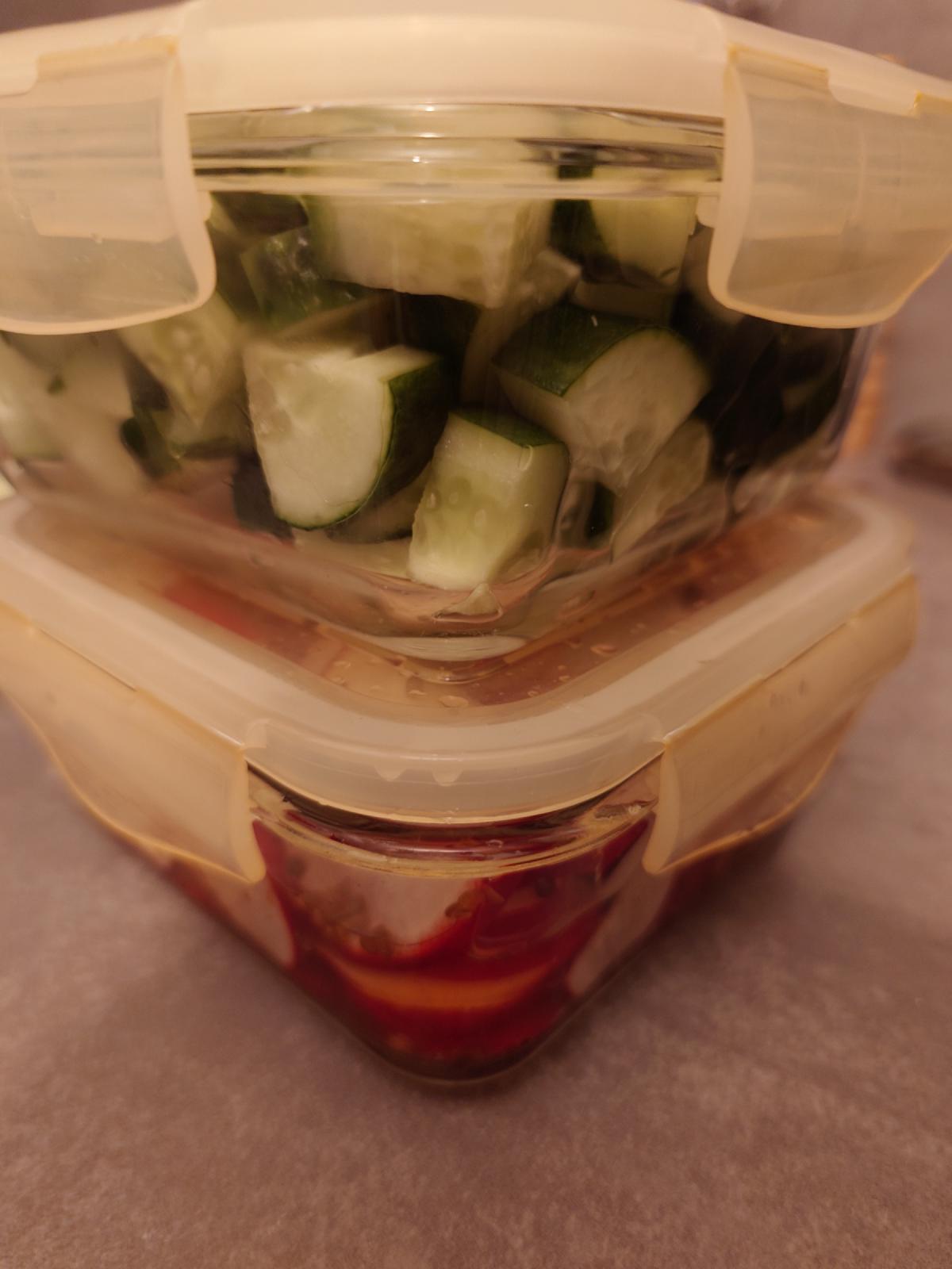 Cucumber and radish stacked in separate containers