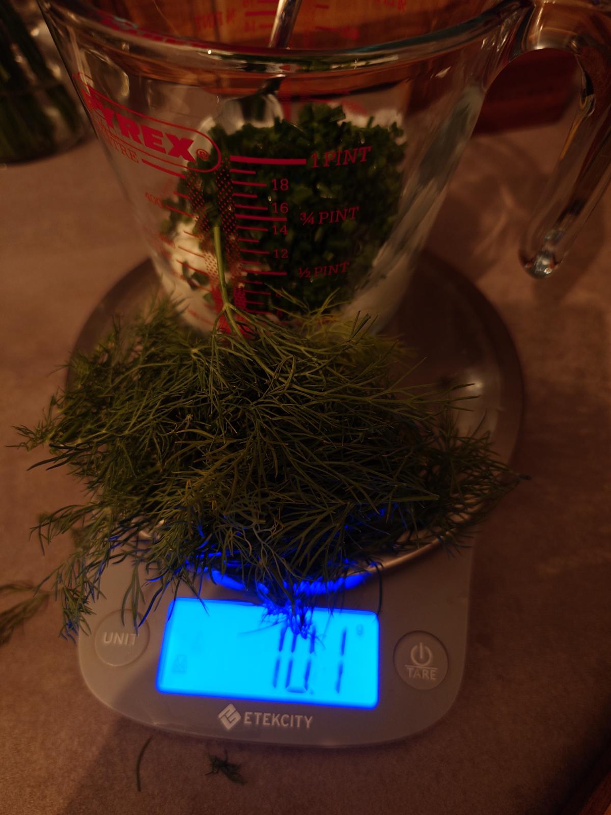 Dill weighed next to the jug