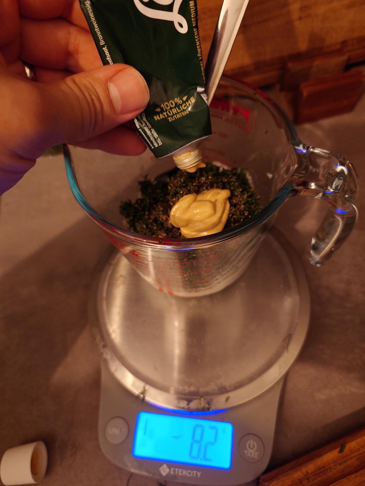 Mustard squeezed into the herbs