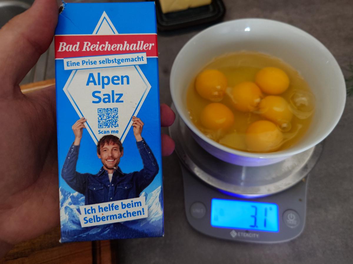 Salt weighed onto the six cracked eggs