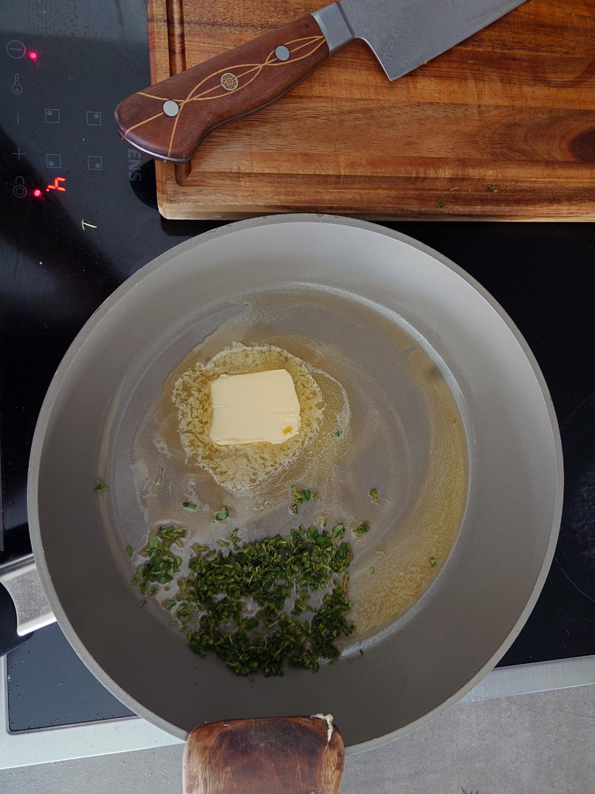 Chopped thyme going into the melting butter
