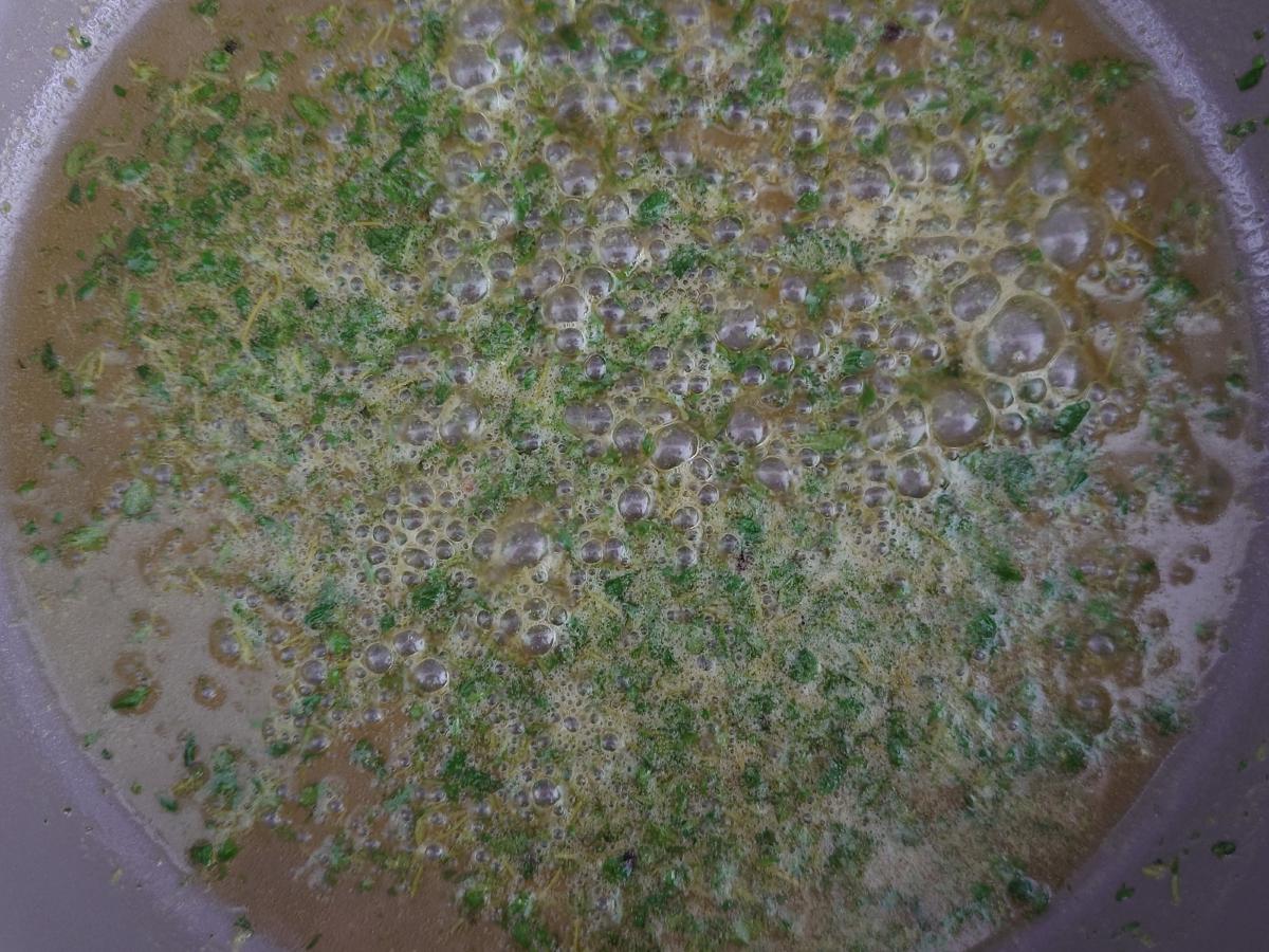 Butter foaming around the thyme