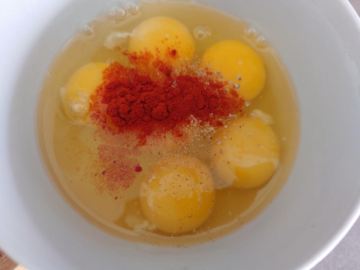 Paprika and pepper on the eggs
