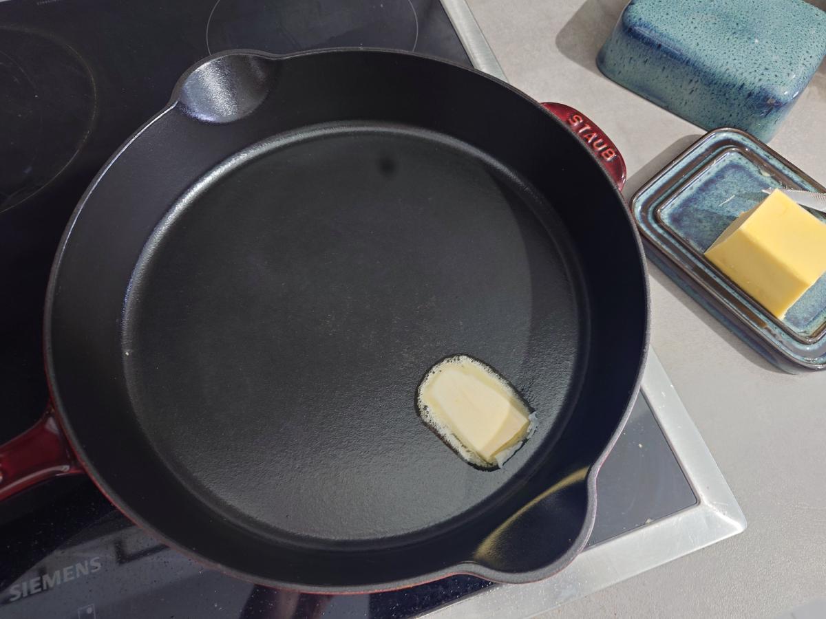 Butter melted in the cast iron pan
