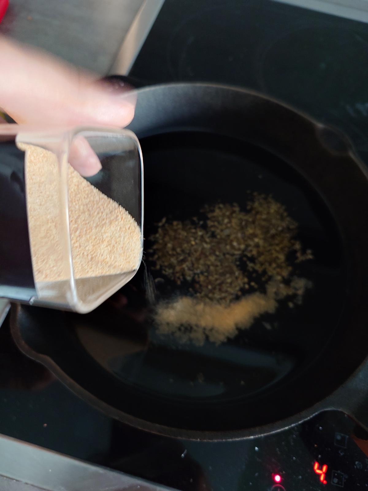 Granulated garlic tipped in from a shaker, dial now reading 4